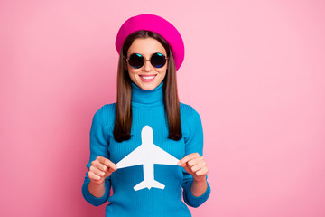 Sticker - Close-up portrait of her she nice attractive lovely pretty cute charming cheerful cheery girl holding in hand paper plane card destination traveler isolated over pink pastel color background