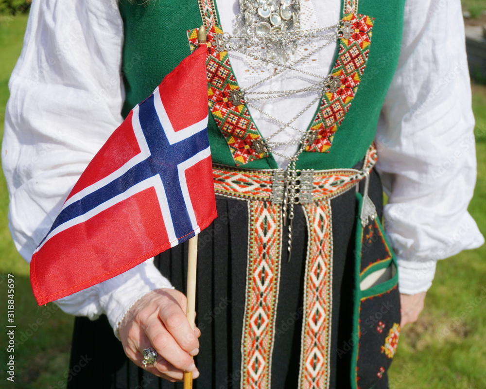 Midsection Of Woman Wearing Traditional Clothing While Holding Norwegian Flag - obrazy, fototapety, plakaty 