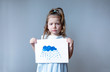 © Angelina - sad little girl holding a cloud drawing