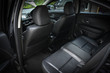 © sutichak - black leather of back seat interior inside modern vehicle car automobile
