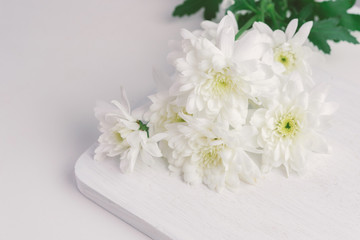 Wall Mural - white flower on wood background