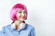 © ansyvan - Happy girl wearing pink wig and headphones