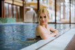 © BGStock72 - Young woman relaxing in spa swimming pool