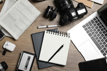 Flat Lay Composition With Equipment For Journalist On Wooden Table