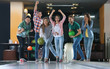 © New Africa - Young woman throwing ball and spending time with friends in bowling club