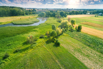 Wall Mural - aerial view of countryside and brook on a spring sunny day. beautiful nature landscape in spring