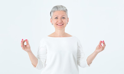 Portrait calm mature woman relaxing meditation. Business woman practicing breathing yoga exercises on isolated over white background. Female is no stress free relief at work.