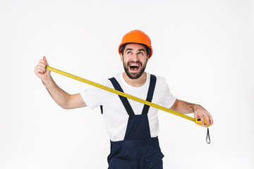 Sticker - Happy young man builder holding centimeter.