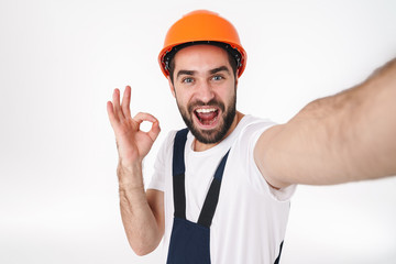 Sticker - Positive young man take selfie showing okay gesture.