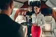 Pilot and flight attendant in private jet