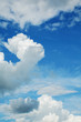 cumulus and cirrus clouds against a blue sky summer day