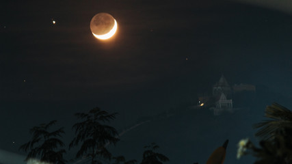moon besides the temple on the hill at wankaner, gujarat, india