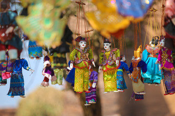 Wall Mural - Bright souvenirs and puppets on the market in the ancient pagoda in Bagan, Myanmar