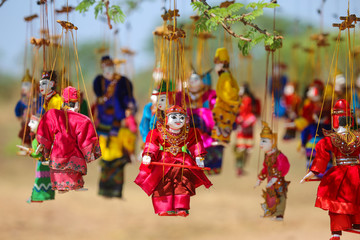 Wall Mural - Bright souvenirs and puppets on the market in the ancient pagoda in Bagan, Myanmar