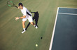 Tennis player hitting a forehand from baseline.