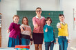 © Kzenon - Thumbs up given by pupils and teacher because school is great