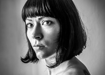 Close up portrait of young European woman in black and white