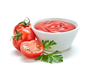 Tomato cherry sauce in bowl, cooking concept. Fresh, organic tomato puree, isolated on white. Healthy vitamin vegetables, vegan diet food condiment. Raw tasty cherry ketchup.