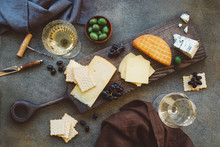 Flat Lay Of Cheese Platter With Cheese Assortment, Grapes And Nuts. Party Or Gathering Eating Concept