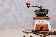 Old Coffee Grinder For Grinding Coffee Beans. Grey Background