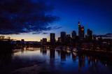 Fototapeta  - Spectacular view on the night city of Frankfurt reflecting in the river