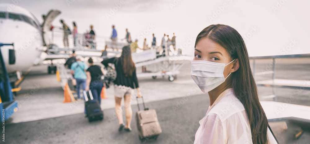 COVID Travel Airport Asian woman tourist boarding plane leaving on vacation wearing face mask. Coronavirus corona virus banner panoramic. Social distance, travel ban restriction, tourism. - obrazy, fototapety, plakaty 