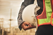 Close up hand holding white helmet hard hat Engineering concept