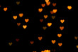 canvas print picture - Black background with bright warm heart shaped bokeh lights. Holiday, Valentines Day background. Ideal to layer with any design. Horizontal