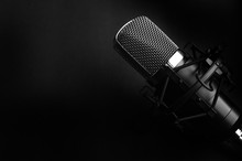 Condenser Black Studio Microphone On A Black Background. Streamer, Podcasts, Music Background