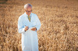 © Kzenon - Scientist doing field test of new GMO grain for better yield