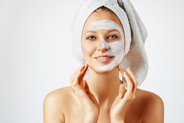 Wall Mural - cosmetology, skin care, face treatment, spa and natural beauty concept. woman with facial mask.