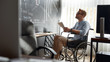 © Svitlana - Thinking about future. Portrait of focused young male trader in a wheelchair holding some documents and looking at charts and graphs on blackboard while working in the modern office