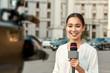TV reporter presenting the news outdoors. Journalism industry, live streaming concept.