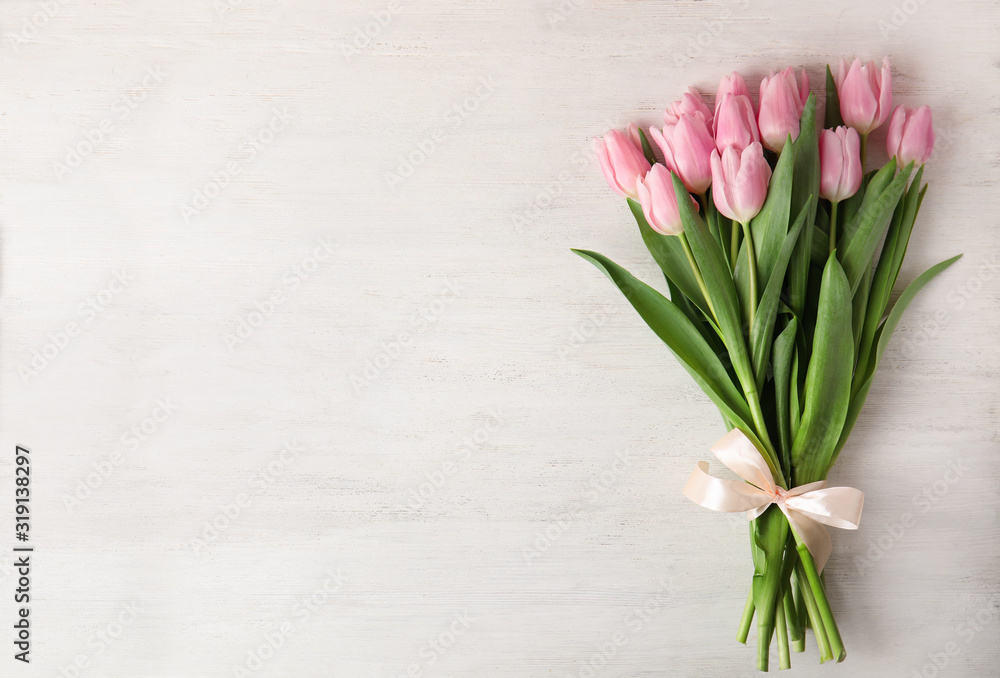 Beautiful pink spring tulips on white wooden background, top view. Space for text - obrazy, fototapety, plakaty 