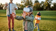 © Svitlana - Digital weekend. Family playing in virtual reality glasses outdoors