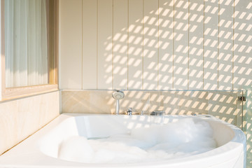 White bathtub and jacuzzi decoration interior