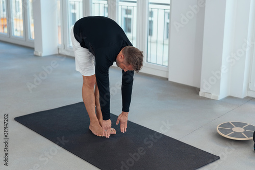 Man doing stretching exercises for mobility