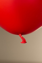Canvas Print - red helium balloon on beige background
