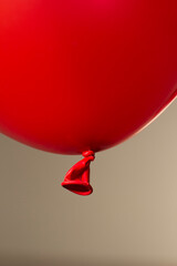 Canvas Print - red helium balloon on beige background