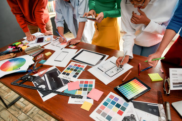 Wall Mural - responsive web design. cropped photo of creative people prototyping new web site design for a client