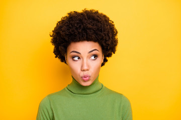 Wall Mural - Close up photo of tender girl with lips pouted on face looking away kissing you isolated over vivid color background