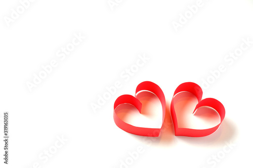 Pair of paper red hearts on white background isolated with copy space. Good love, valentines day, womens day banner, card, invitation, flyer, poster template.