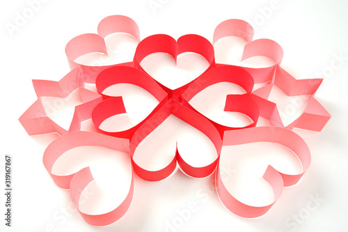 Four of red and four of pink paper hearts and two pink paper stars on white background isolated. Good love, valentines day, womens day banner, offer, card, invitation, flyer, poster template.