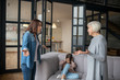 © zinkevych - Mom and grandmother talking seriously, daughter covering her ears.