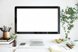 canvas print picture - Modern personal computer with blank white screen, keyboard, mobile phone and office accessories on desk at workplace of graphic designer, blogger. Electronic devices, technology and creativity