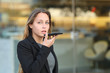 © Antonioguillem - Executive using voice recognition on mobile phone