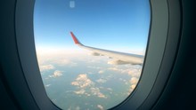 Airplane Wing Is Seen Through Its Window While Flying