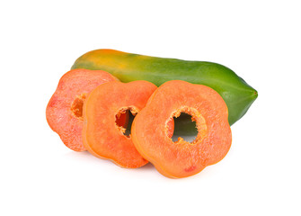  unpeeled and sliced ripe papaya and raw papaya on white background