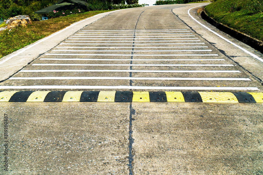 Speed bump road and rumble strip road background. Black and yellow ...
