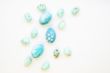 Top View Pastel Blue Decorated Easter Eggs Isolated On White. Handcrafted Easter Chicken And Quail Eggs. Handmade Festive Paint